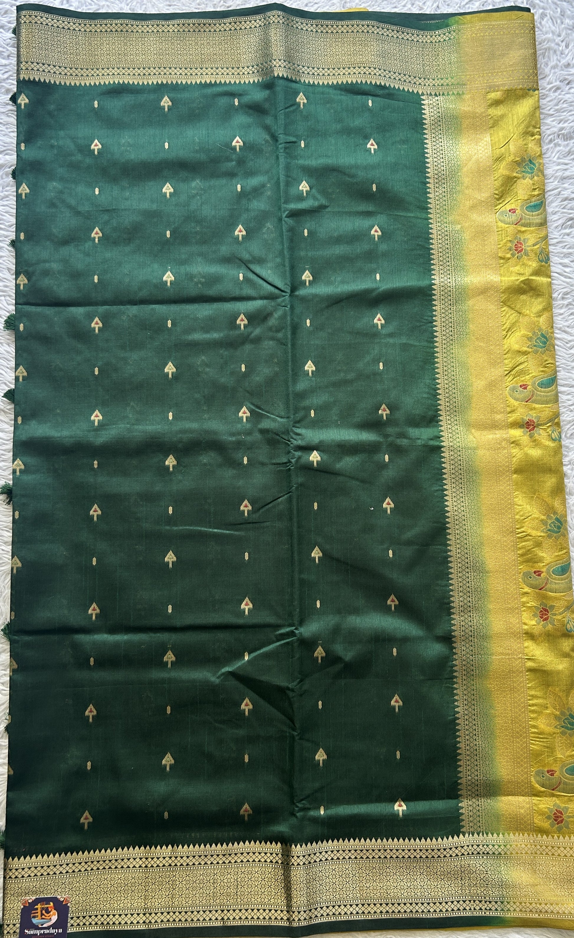 Semi Raw Silk Saree Dark Green Colored Elegantly Paired with a Zari Border. - Sampradaya Designer Studio