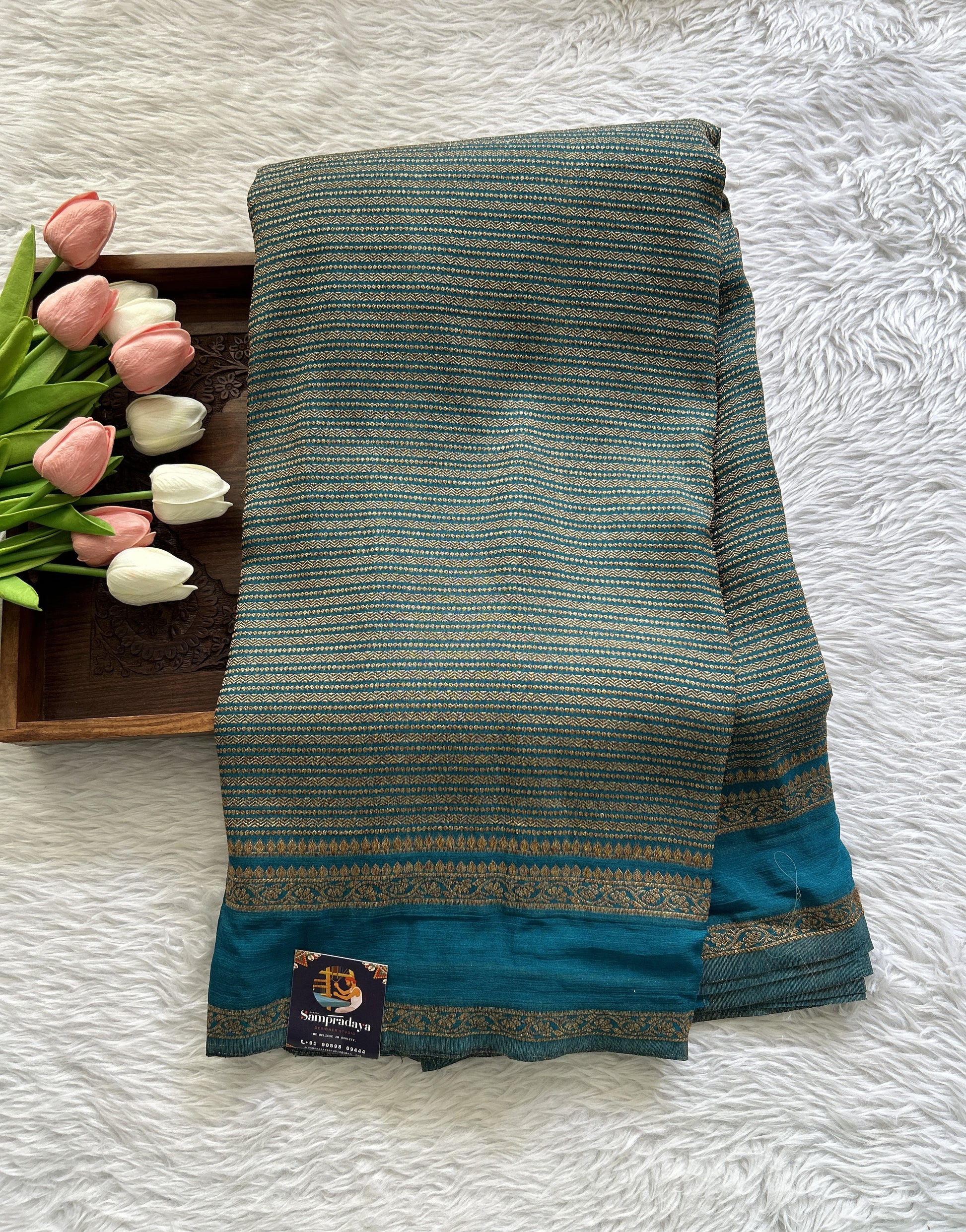 Semi Georgette Saree Turquoise Blue Colored Complemented with a Zari Border. - Sampradaya Designer Studio