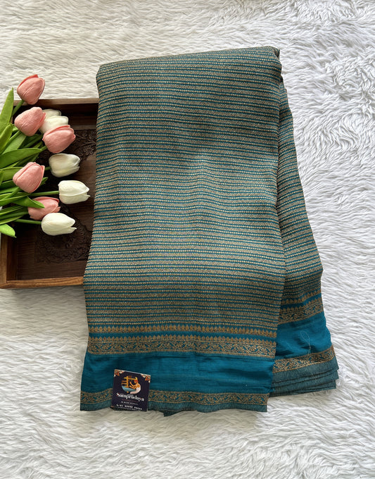 Semi Georgette Saree Turquoise Blue Colored Complemented with a Zari Border. - Sampradaya Designer Studio