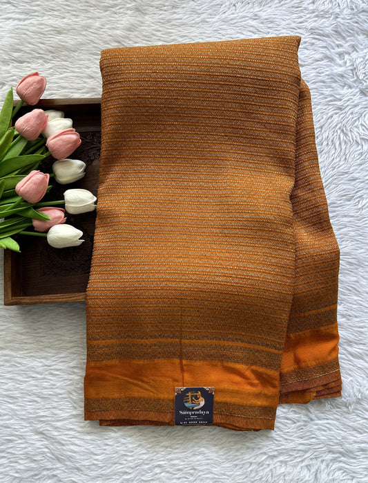 Semi Georgette Saree Orange Colored Complemented with a Zari Border. - Sampradaya Designer Studio