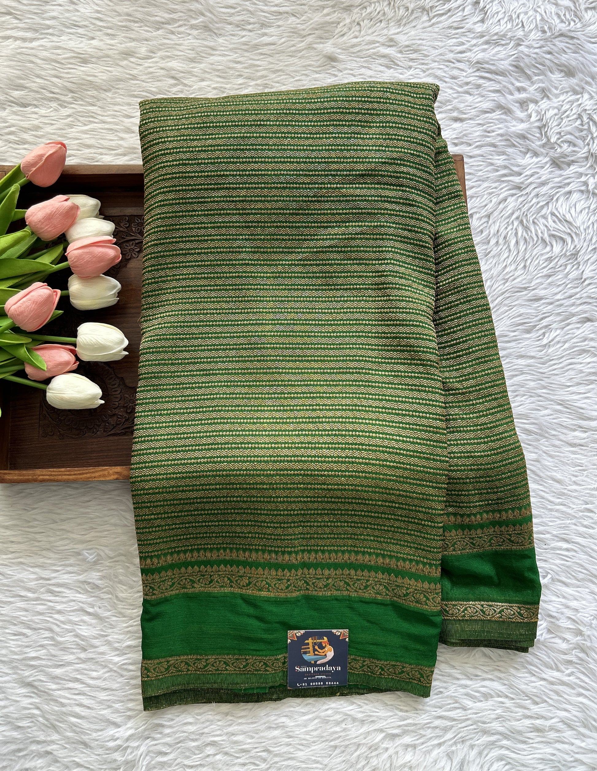 Semi Georgette Saree Green Colored Complemented with a Zari Border. - Sampradaya Designer Studio