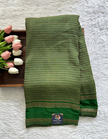 Semi Georgette Saree Green Colored Complemented with a Zari Border. - Sampradaya Designer Studio