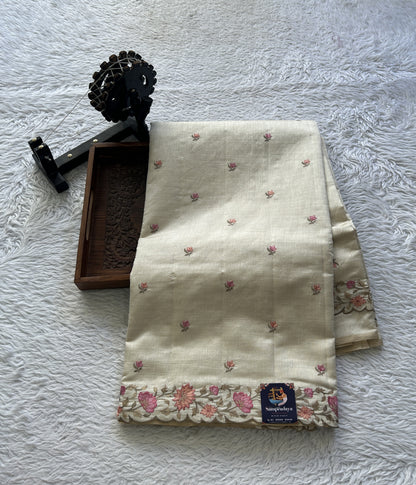 Semi Tussar Saree Pastel Cream Colored complemented with a Embroidered Scallop Border. - Sampradaya Designer Studio