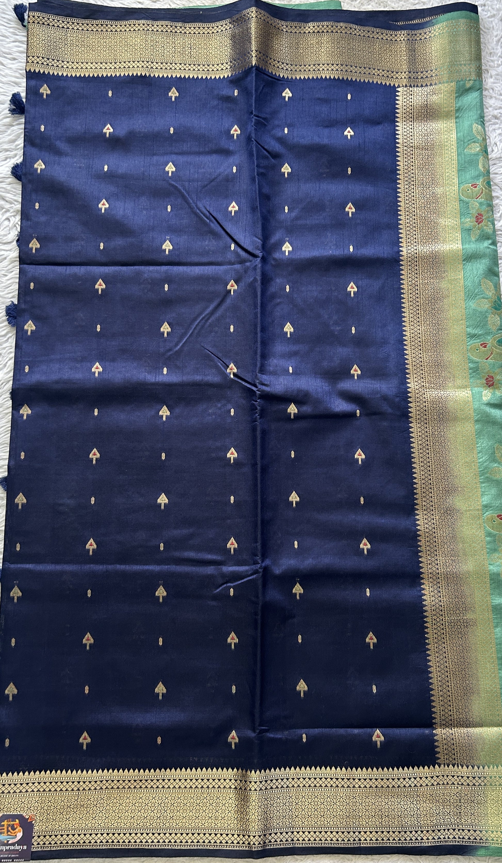 Semi Raw Silk Allover Saree Navy Blue Colored Elegantly Paired with a Zari Border. - Sampradaya Designer Studio
