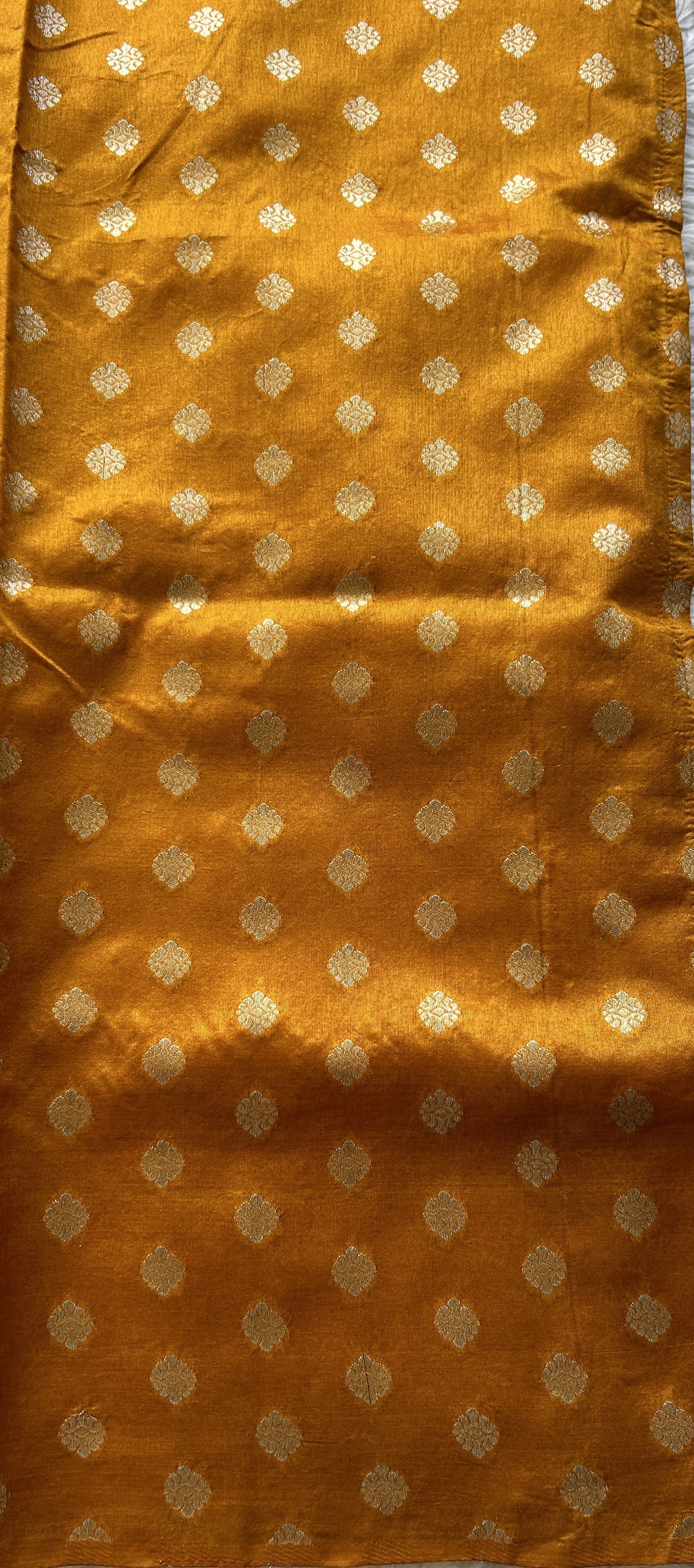 Semi Raw Silk Allover Saree Deep Peach Colored Elegantly Paired with a Zari Border. - Sampradaya Designer Studio