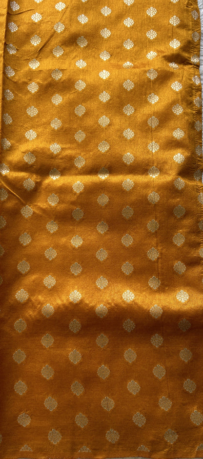 Semi Raw Silk Allover Saree Deep Peach Colored Elegantly Paired with a Zari Border. - Sampradaya Designer Studio