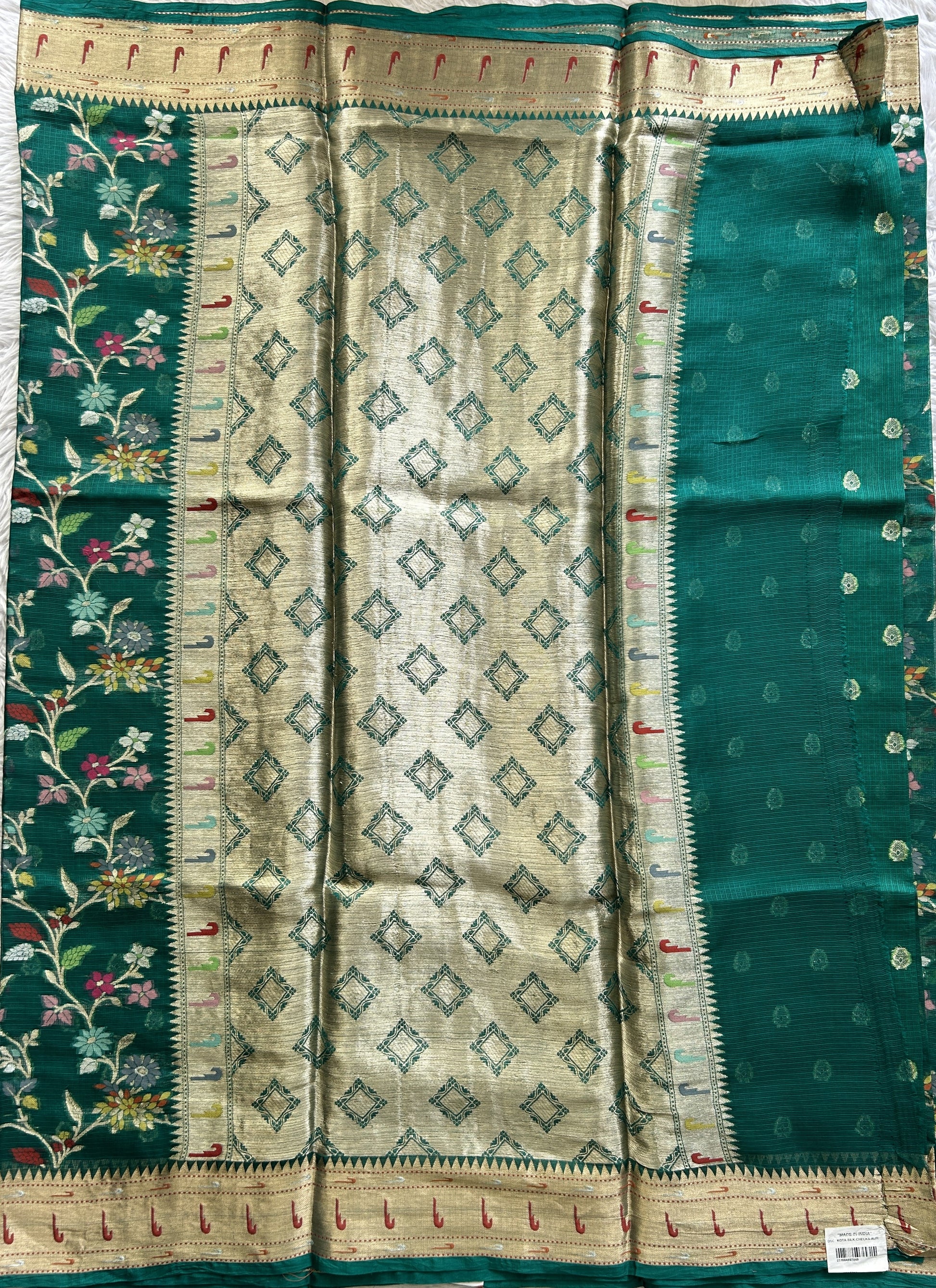 Silk kota Saree Bottle Green color complemented with a Muniya Border. - Sampradaya Designer Studio