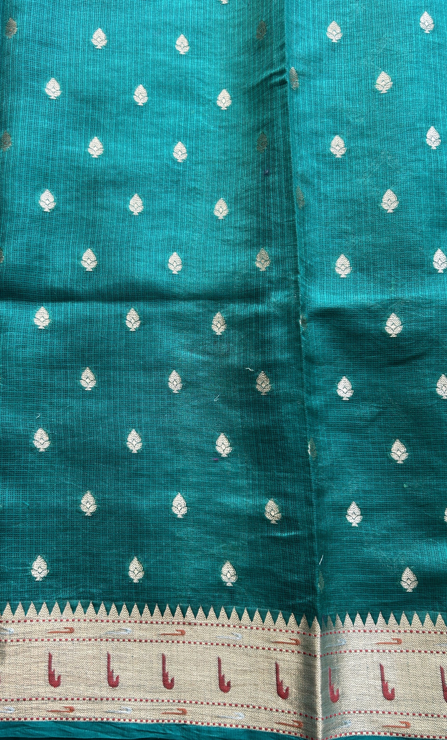Silk kota Saree Bottle Green color complemented with a Muniya Border. - Sampradaya Designer Studio