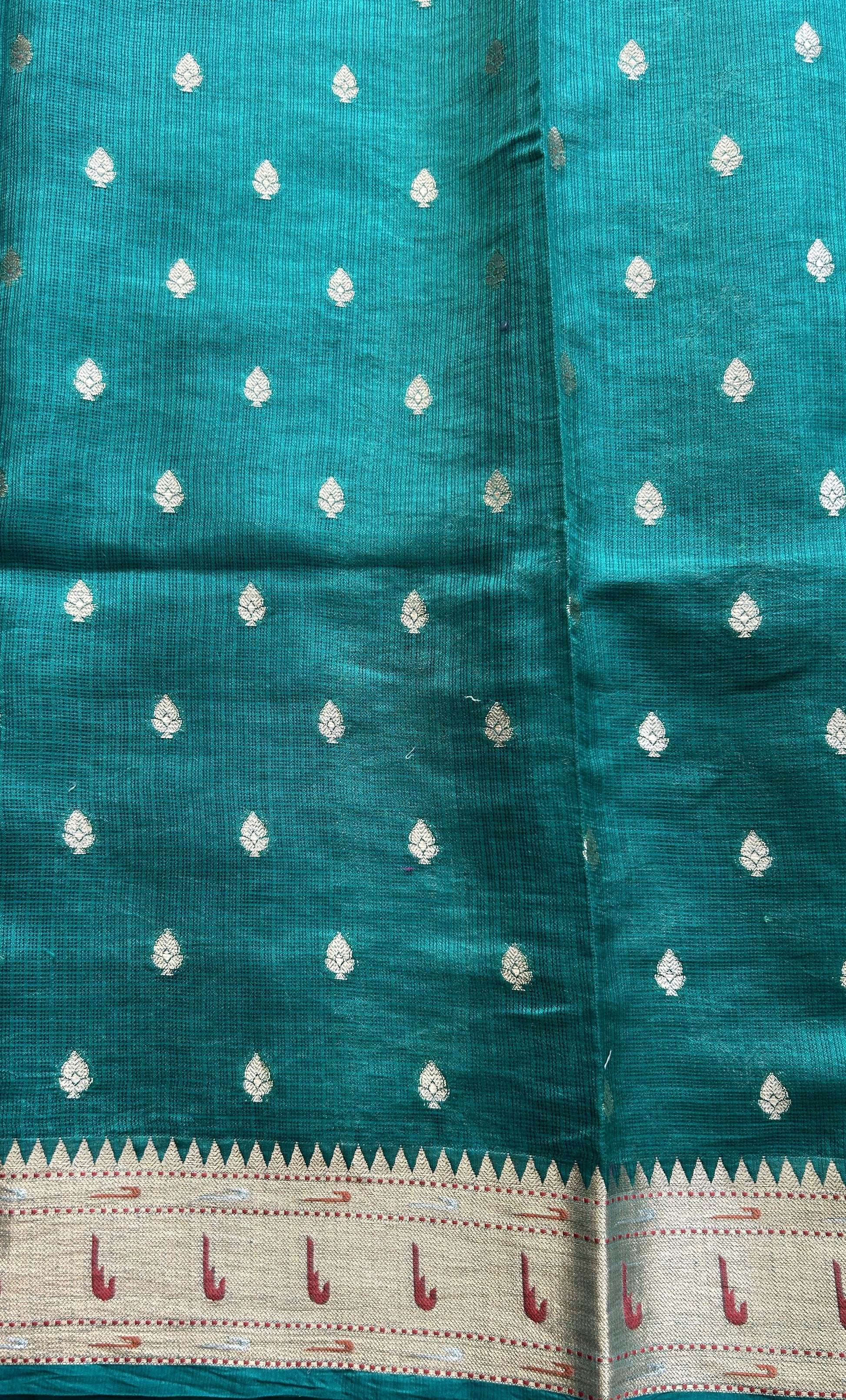 Silk kota Saree Bottle Green color complemented with a Muniya Border. - Sampradaya Designer Studio
