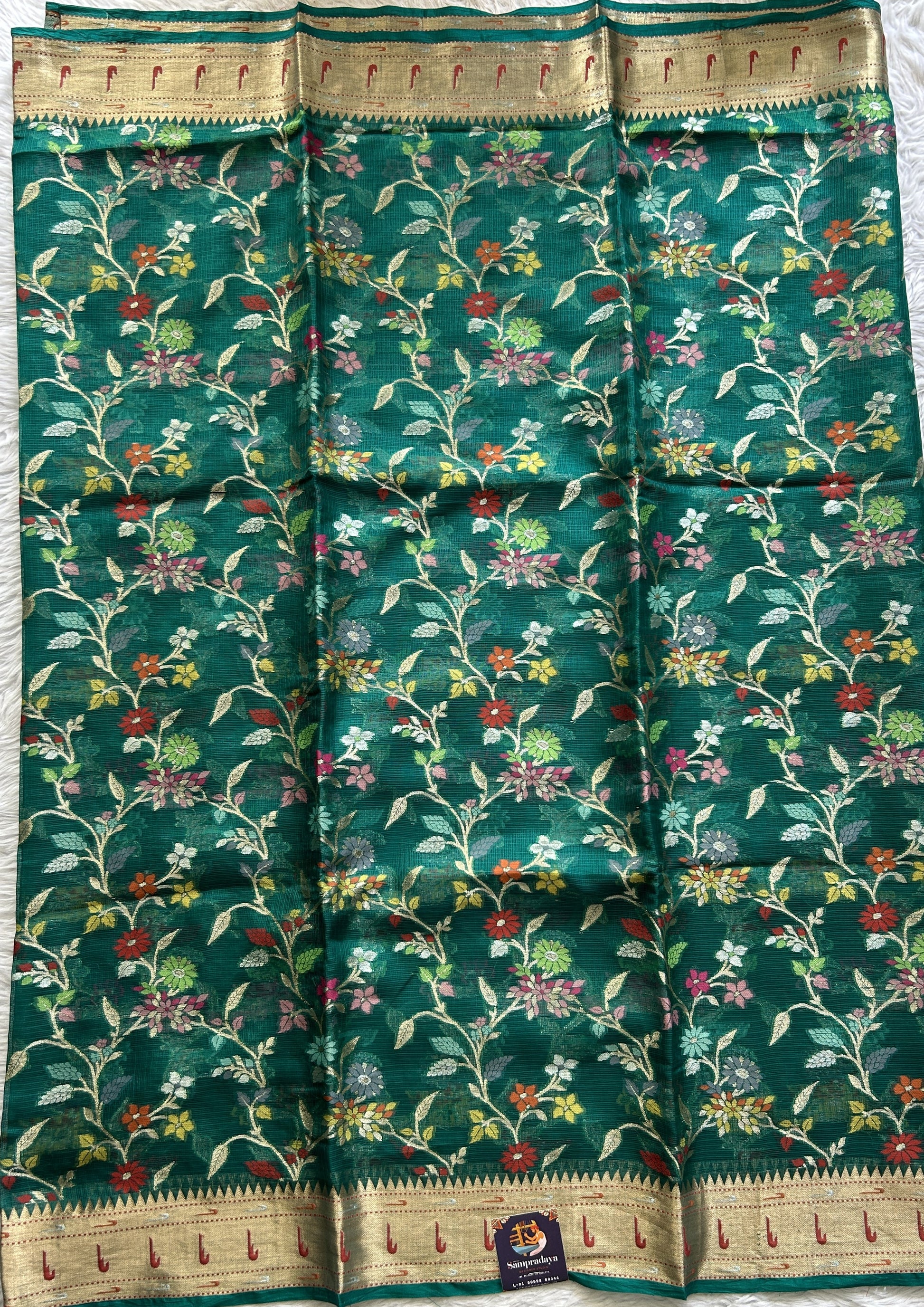 Silk kota Saree Bottle Green color complemented with a Muniya Border. - Sampradaya Designer Studio
