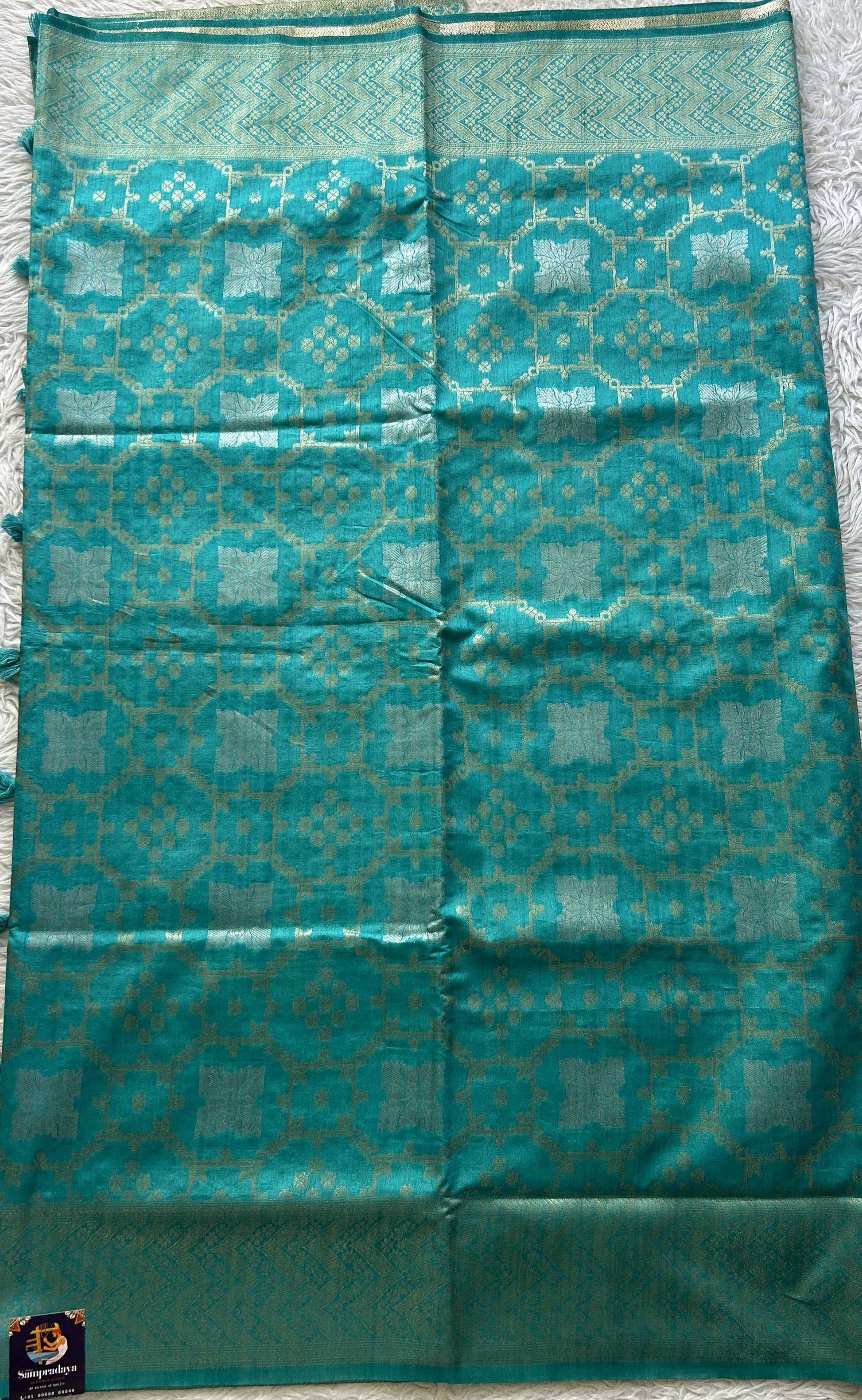 Semi Raw Silk Allover Saree Aqua Blue Colored Elegantly Paired with a Zari Border. - Sampradaya Designer Studio