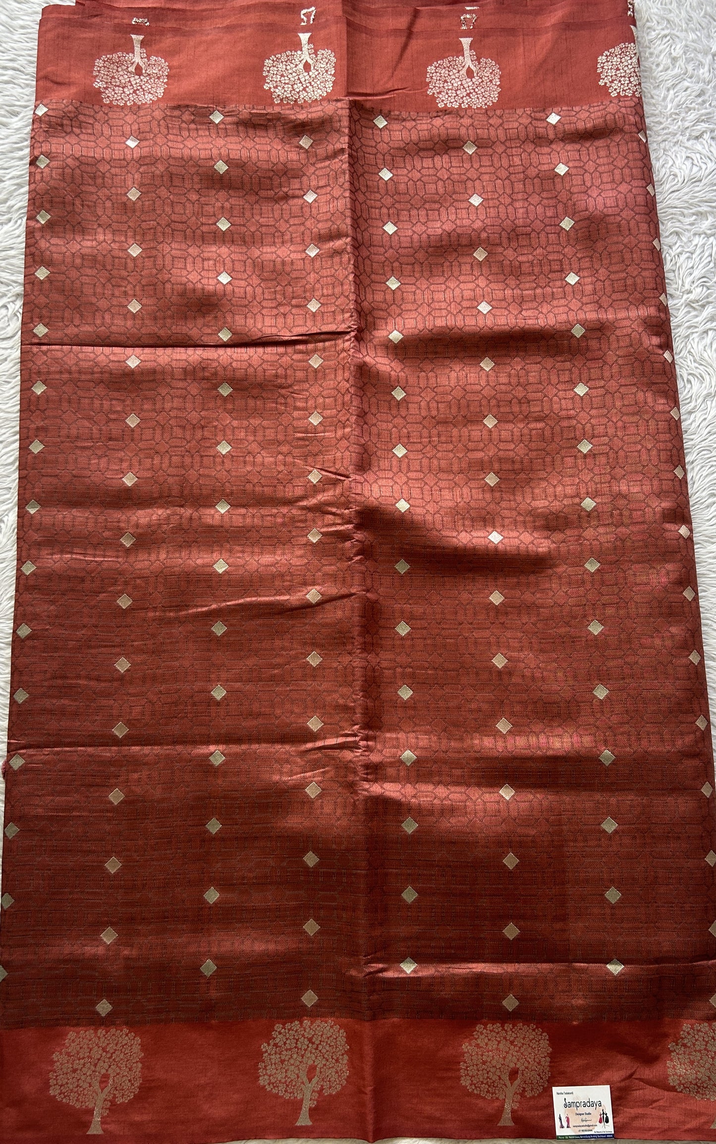 Semi Tussar Saree Rust Colored complemented with a Buti Border. - Sampradaya Designer Studio