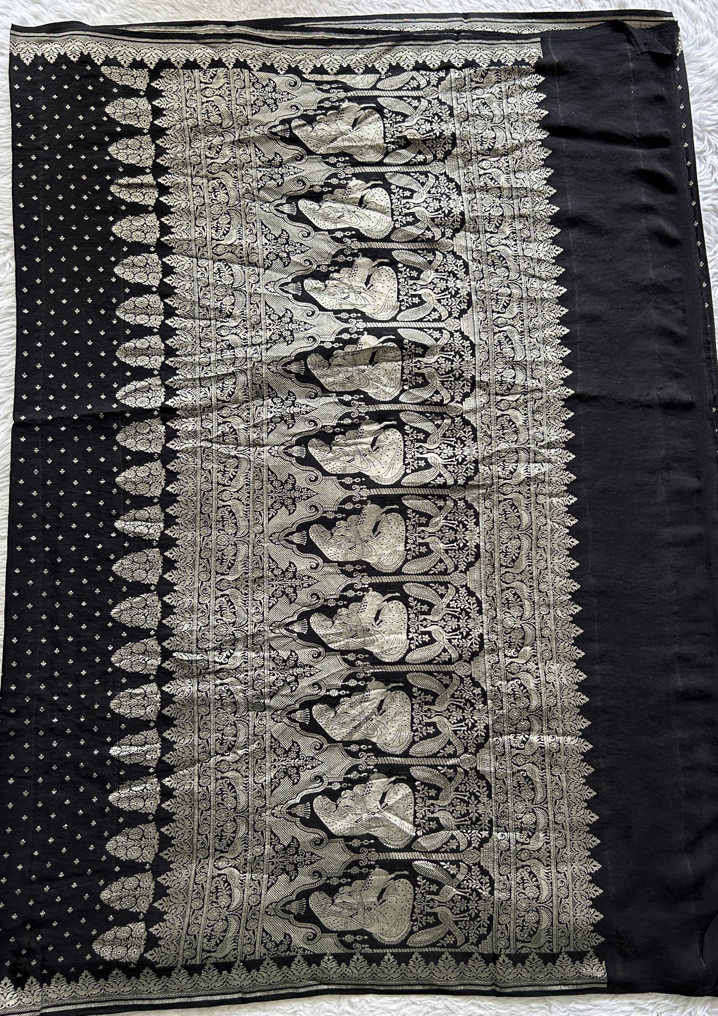 Banarasi Georgette Saree Black colored complemented with a Silver Zari border. - Sampradaya Designer Studio