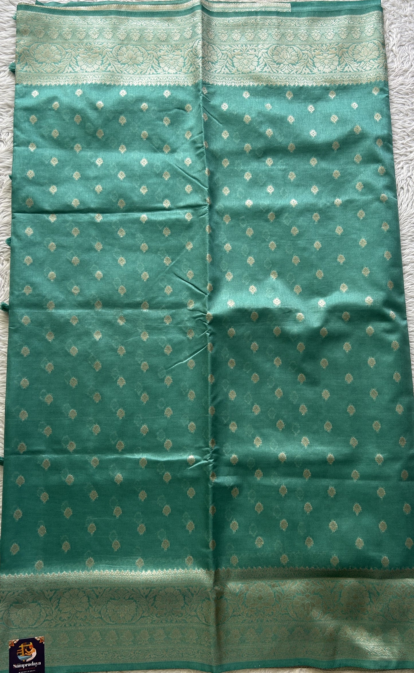 Semi Raw Silk Saree Sea Green Colored Elegantly Paired with a Zari Border. - Sampradaya Designer Studio