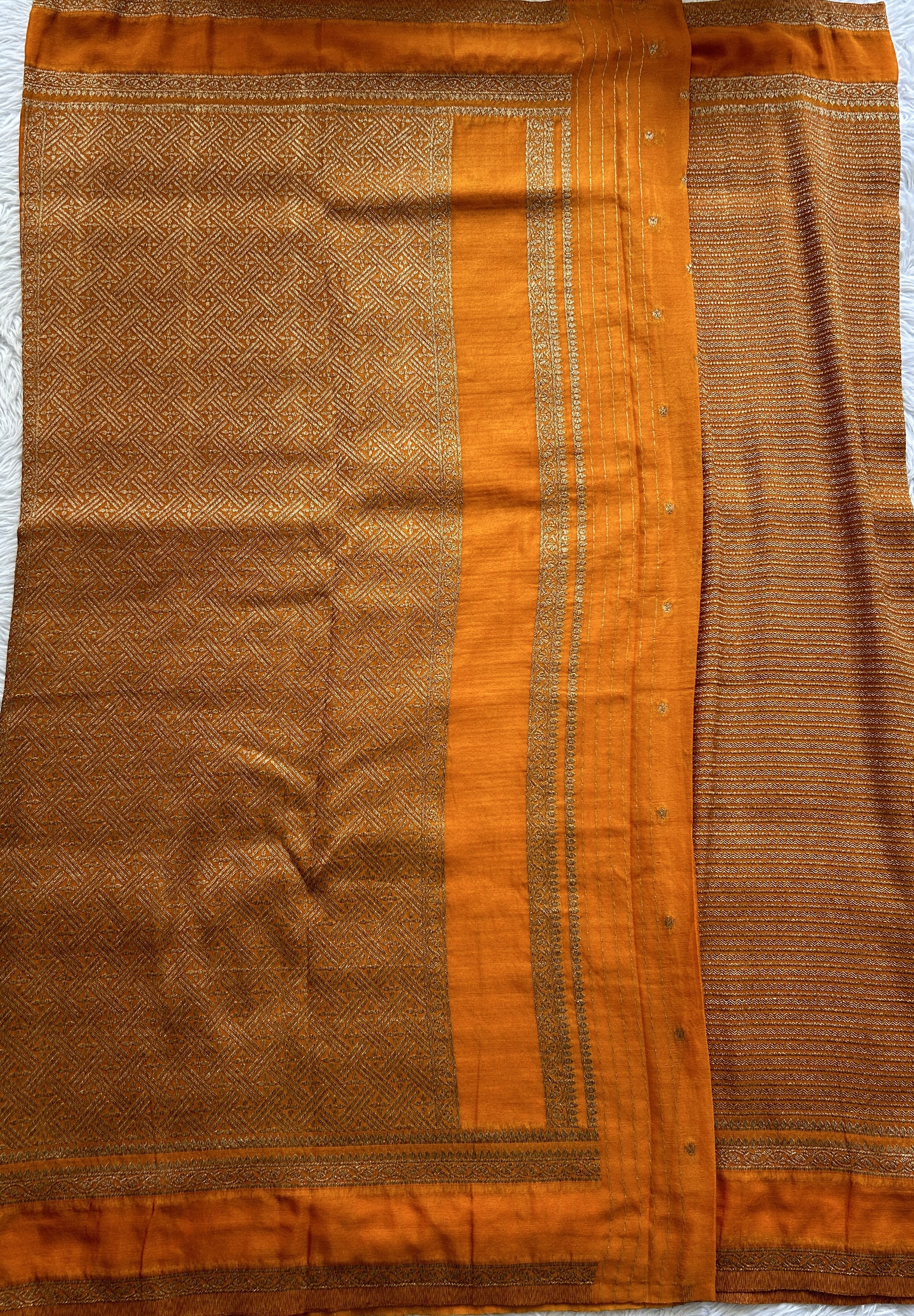 Semi Georgette Saree Orange Colored Complemented with a Zari Border. - Sampradaya Designer Studio