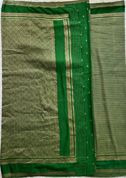 Semi Georgette Saree Green Colored Complemented with a Zari Border. - Sampradaya Designer Studio