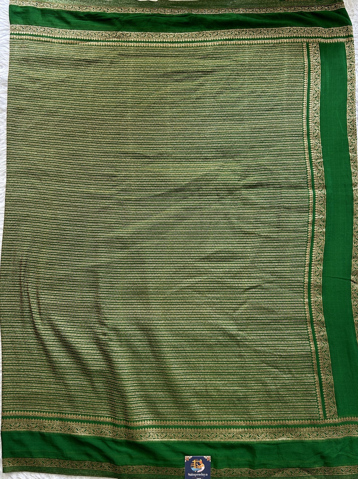 Semi Georgette Saree Green Colored Complemented with a Zari Border. - Sampradaya Designer Studio