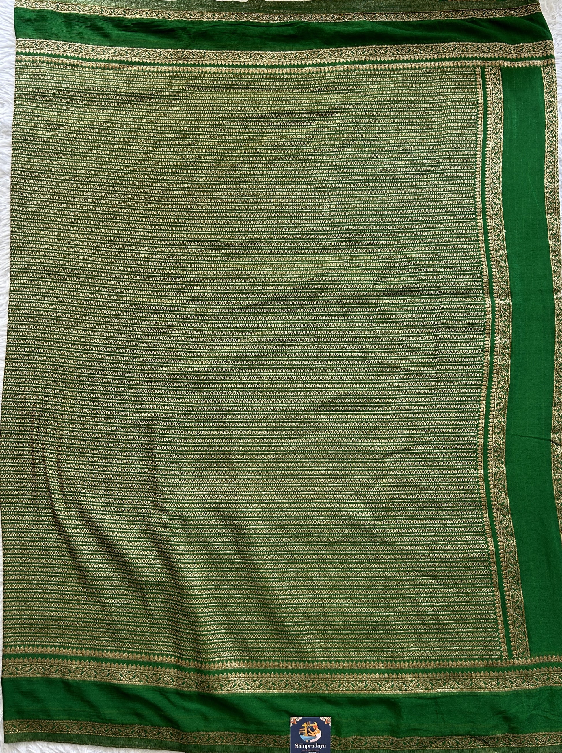 Semi Georgette Saree Green Colored Complemented with a Zari Border. - Sampradaya Designer Studio