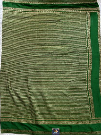 Semi Georgette Saree Green Colored Complemented with a Zari Border. - Sampradaya Designer Studio