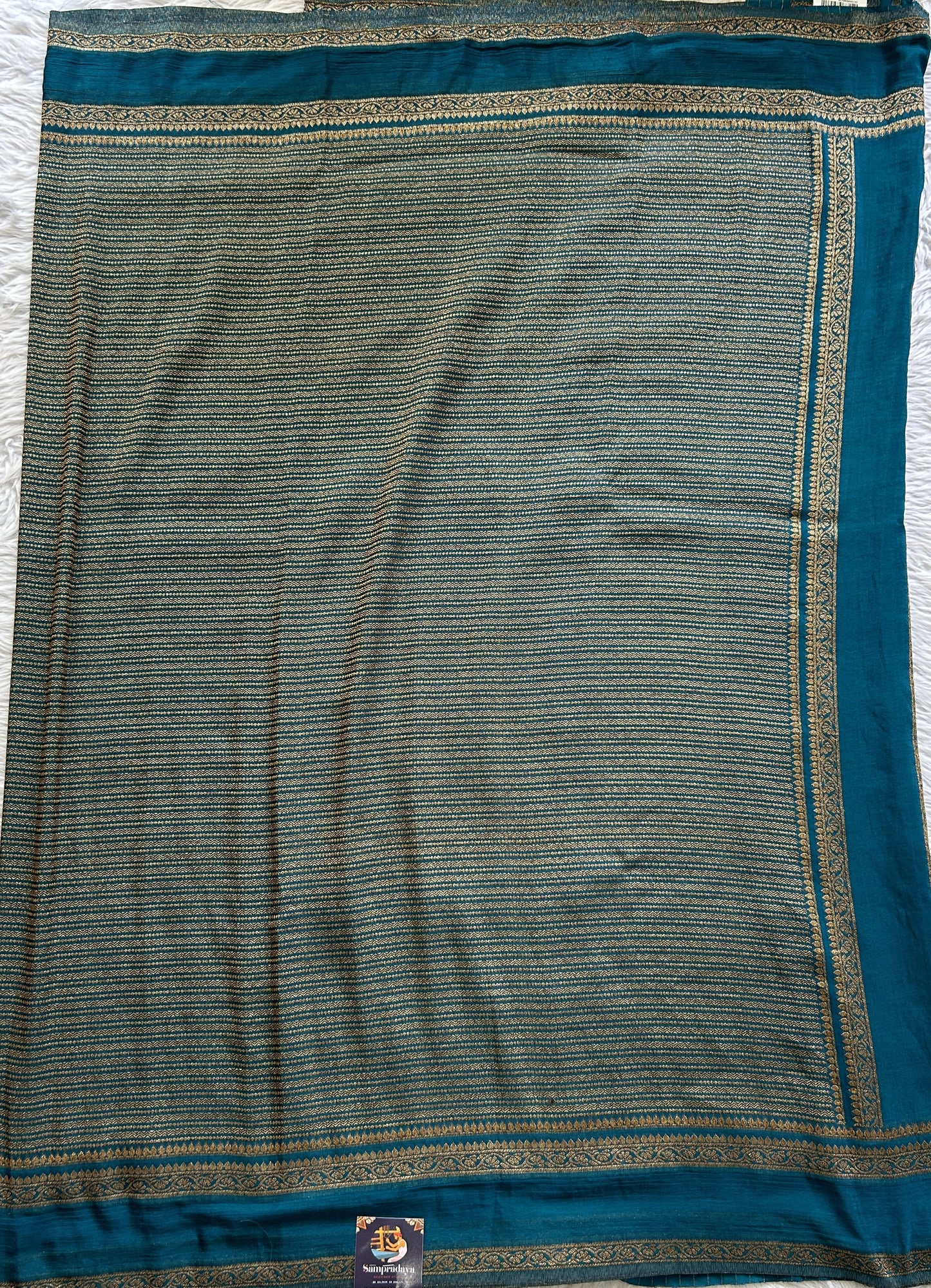 Semi Georgette Saree Turquoise Blue Colored Complemented with a Zari Border. - Sampradaya Designer Studio