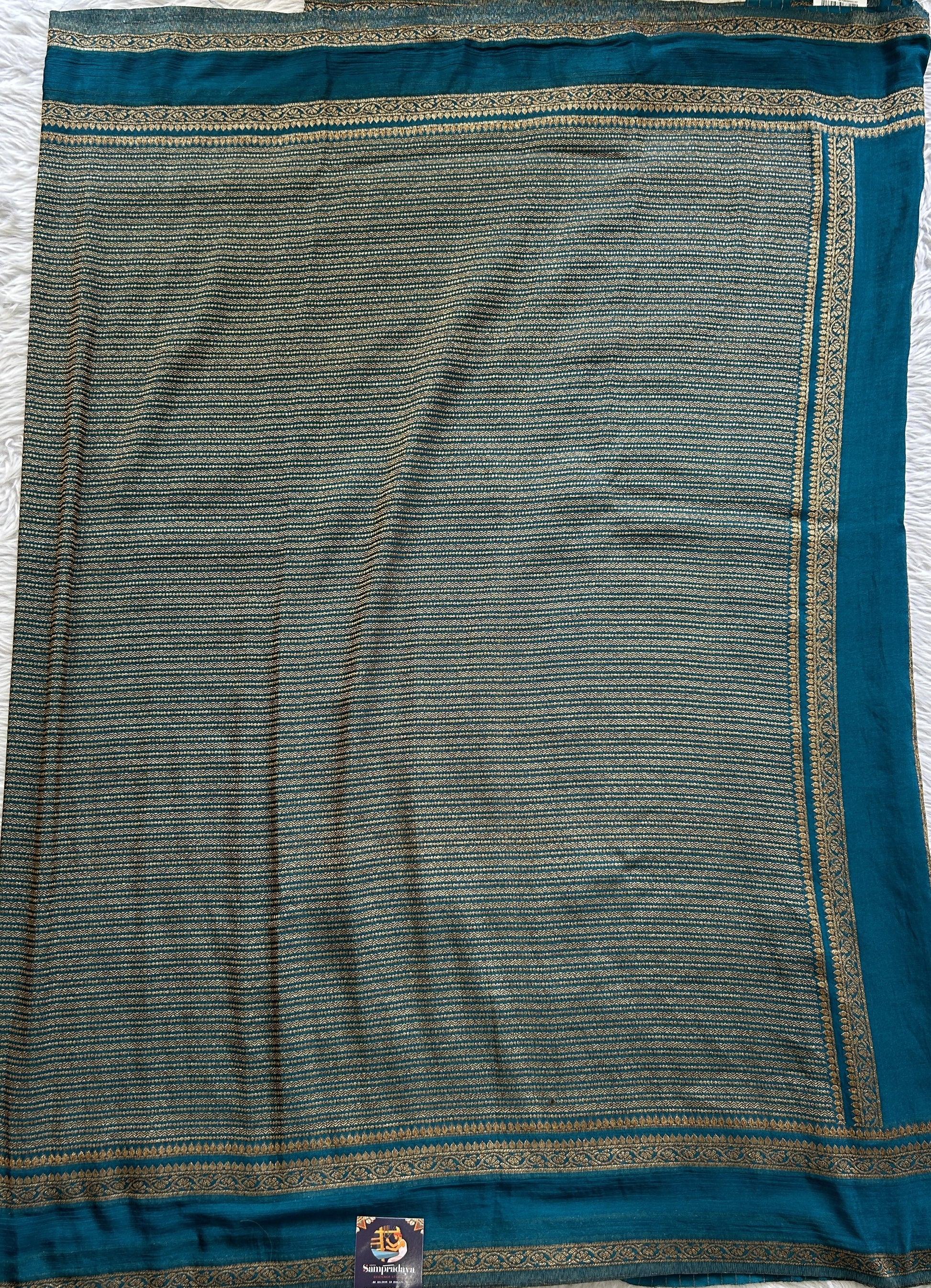 Semi Georgette Saree Turquoise Blue Colored Complemented with a Zari Border. - Sampradaya Designer Studio