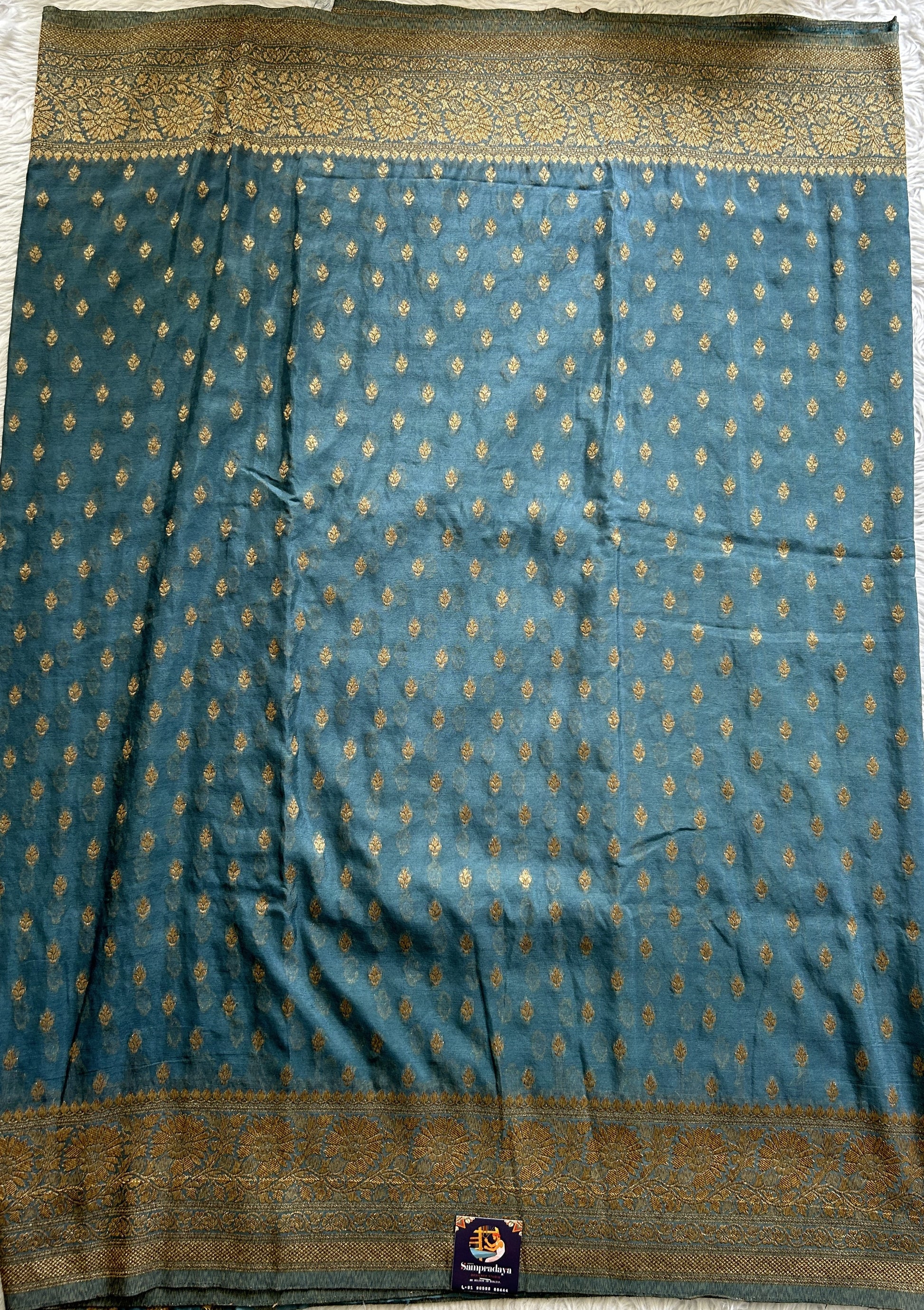 Semi Georgette Saree Aqua Blue Colored Complemented with a Zari Border. - Sampradaya Designer Studio