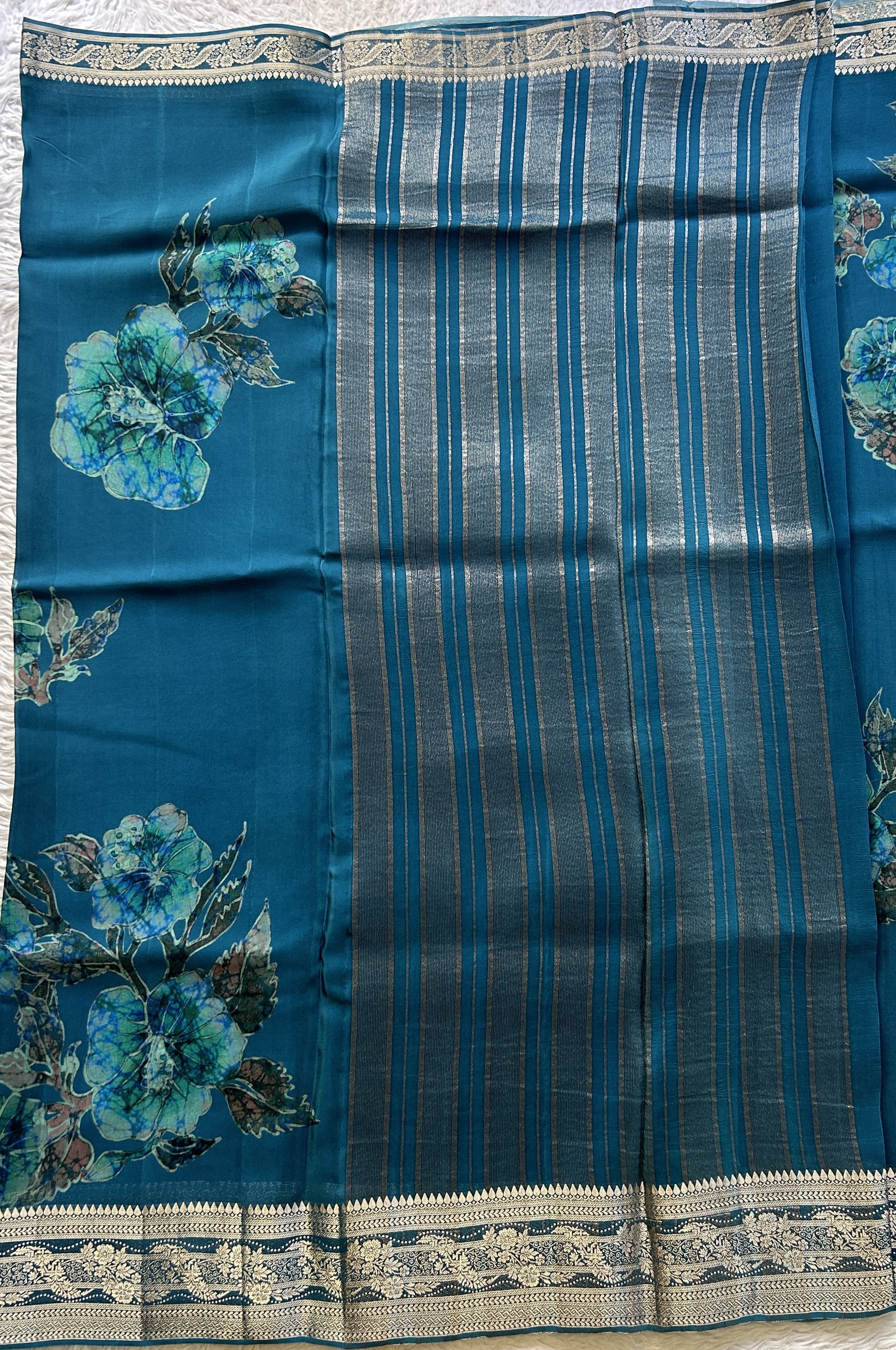 Satin Georgette Saree Peacock Blue Colored Elegantly Paired with a Zari Border. - Sampradaya Designer Studio