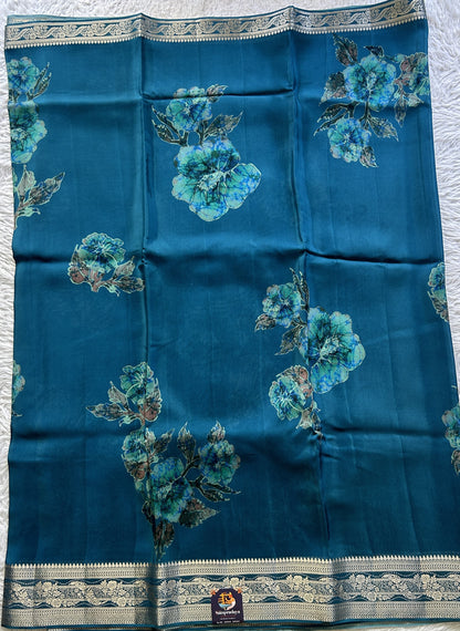 Satin Georgette Saree Peacock Blue Colored Elegantly Paired with a Zari Border. - Sampradaya Designer Studio