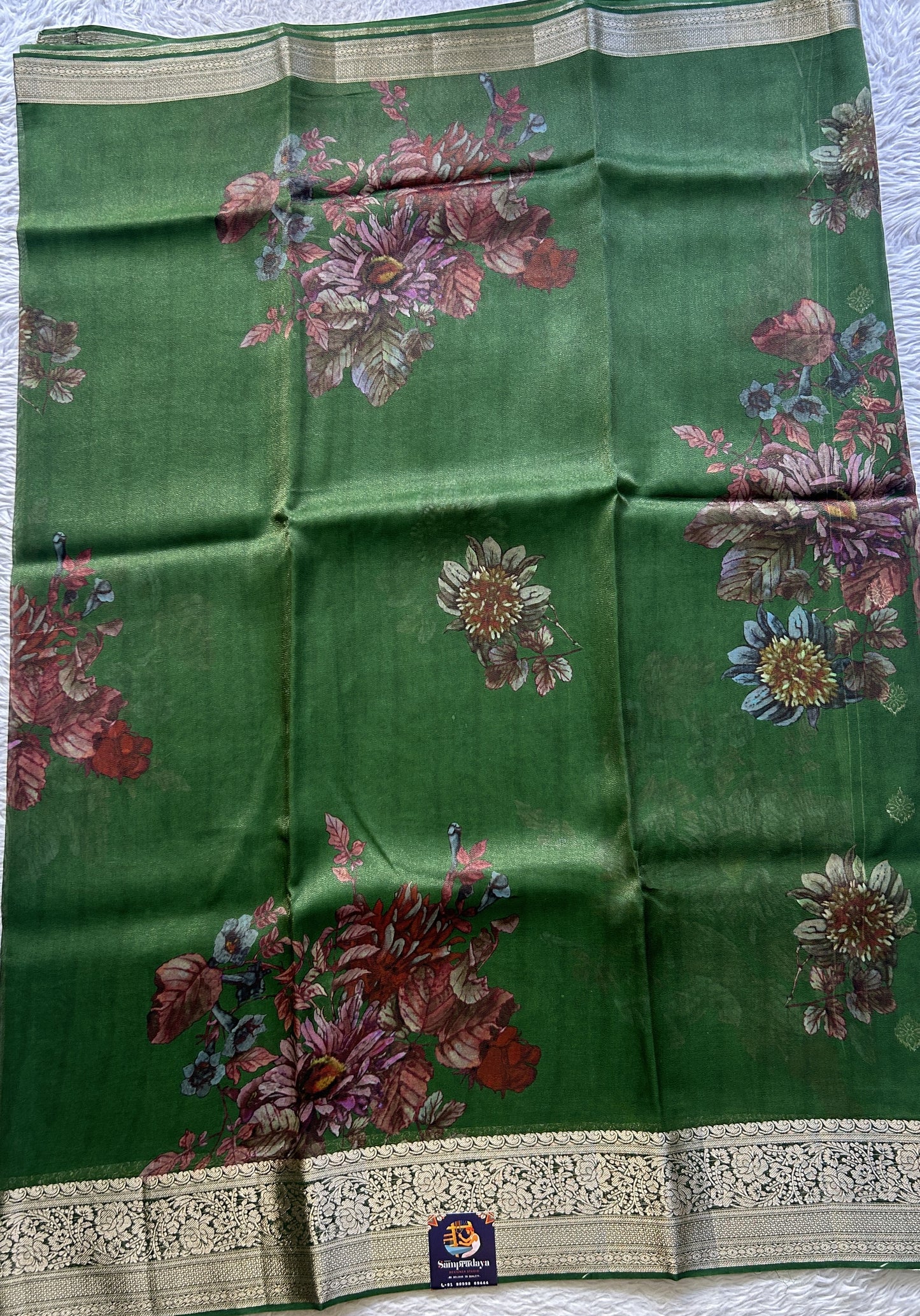 Satin Georgette Saree Green Colored Elegantly Paired with a Zari Border. - Sampradaya Designer Studio