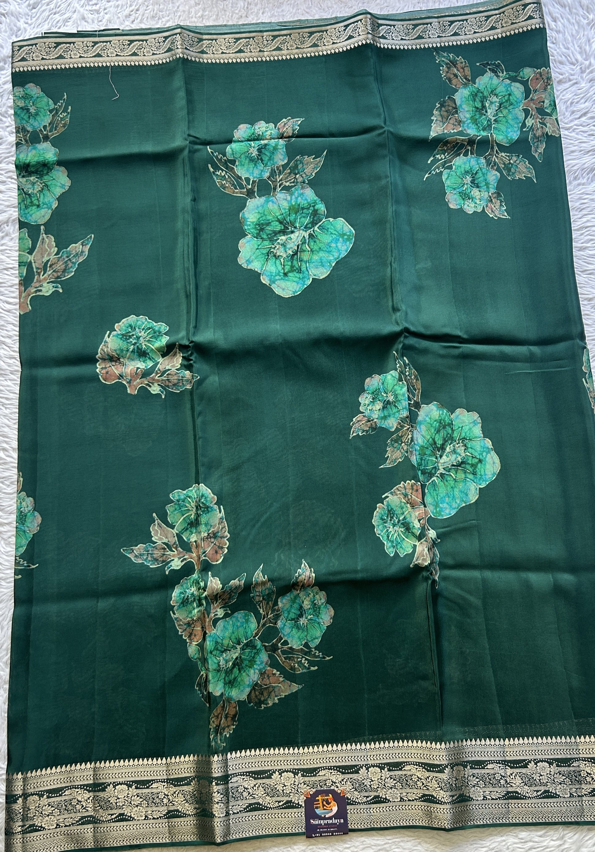 Satin Georgette Saree Bottle Green Colored Elegantly Paired with a Zari Border. - Sampradaya Designer Studio