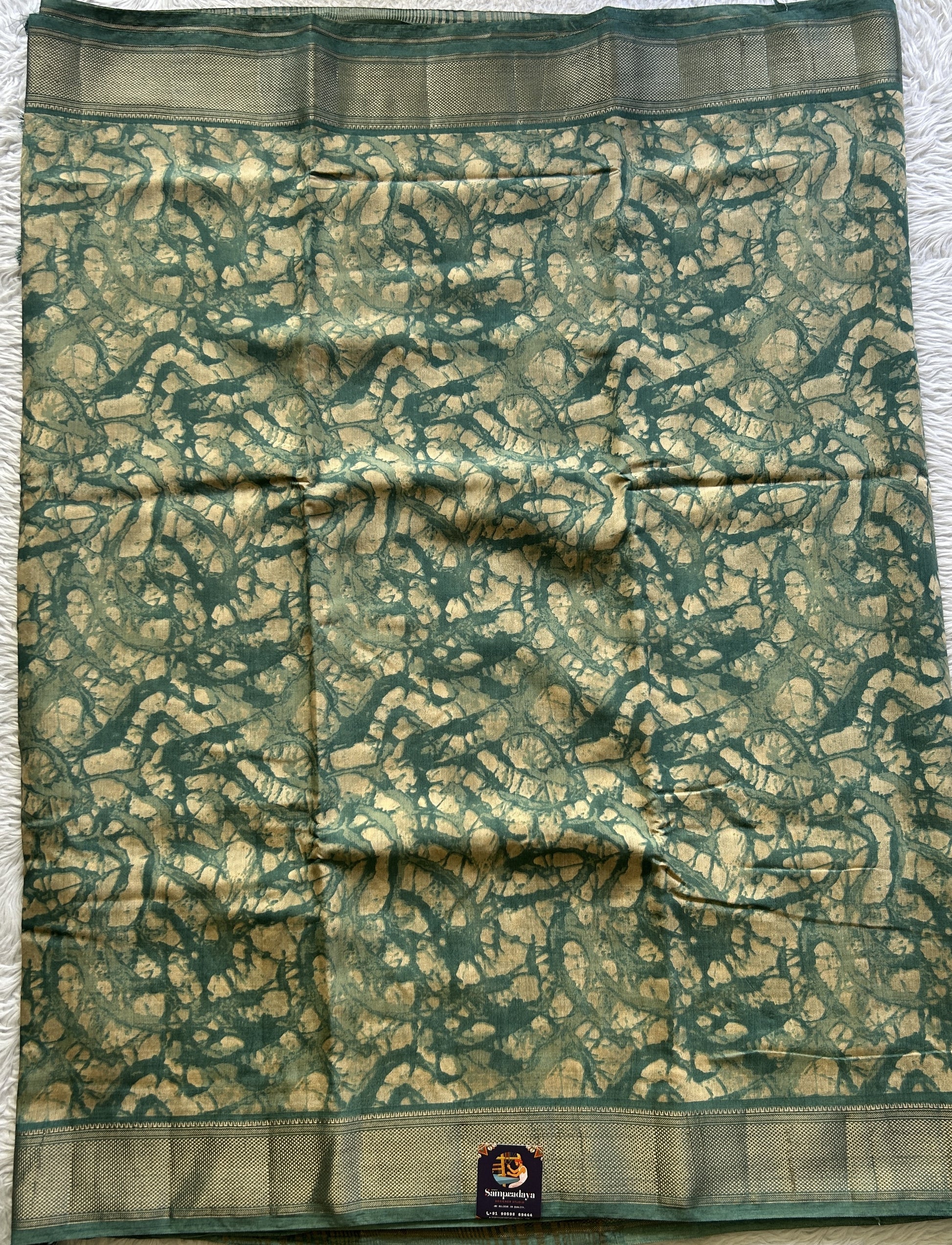 Dola Crepe Saree Ocean Green Colored Elegantly Paired with a Zari Border. - Sampradaya Designer Studio