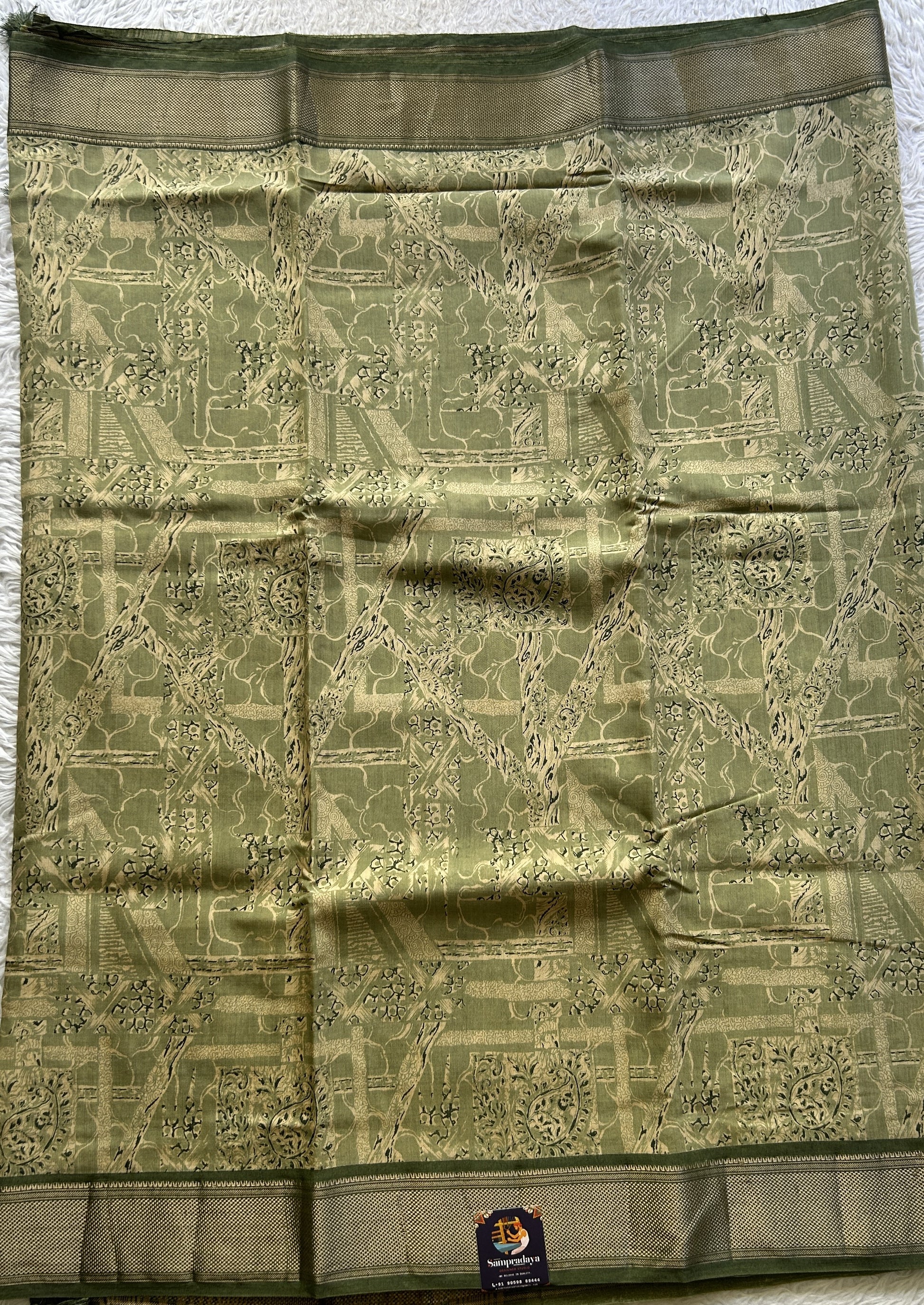 Dola Crepe Saree Light Green Colored Elegantly Paired with a Zari Border. - Sampradaya Designer Studio