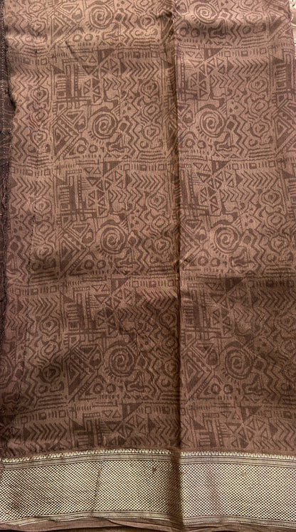 Dola Crepe Saree Light Brown Colored Elegantly Paired with a Zari Border. - Sampradaya Designer Studio