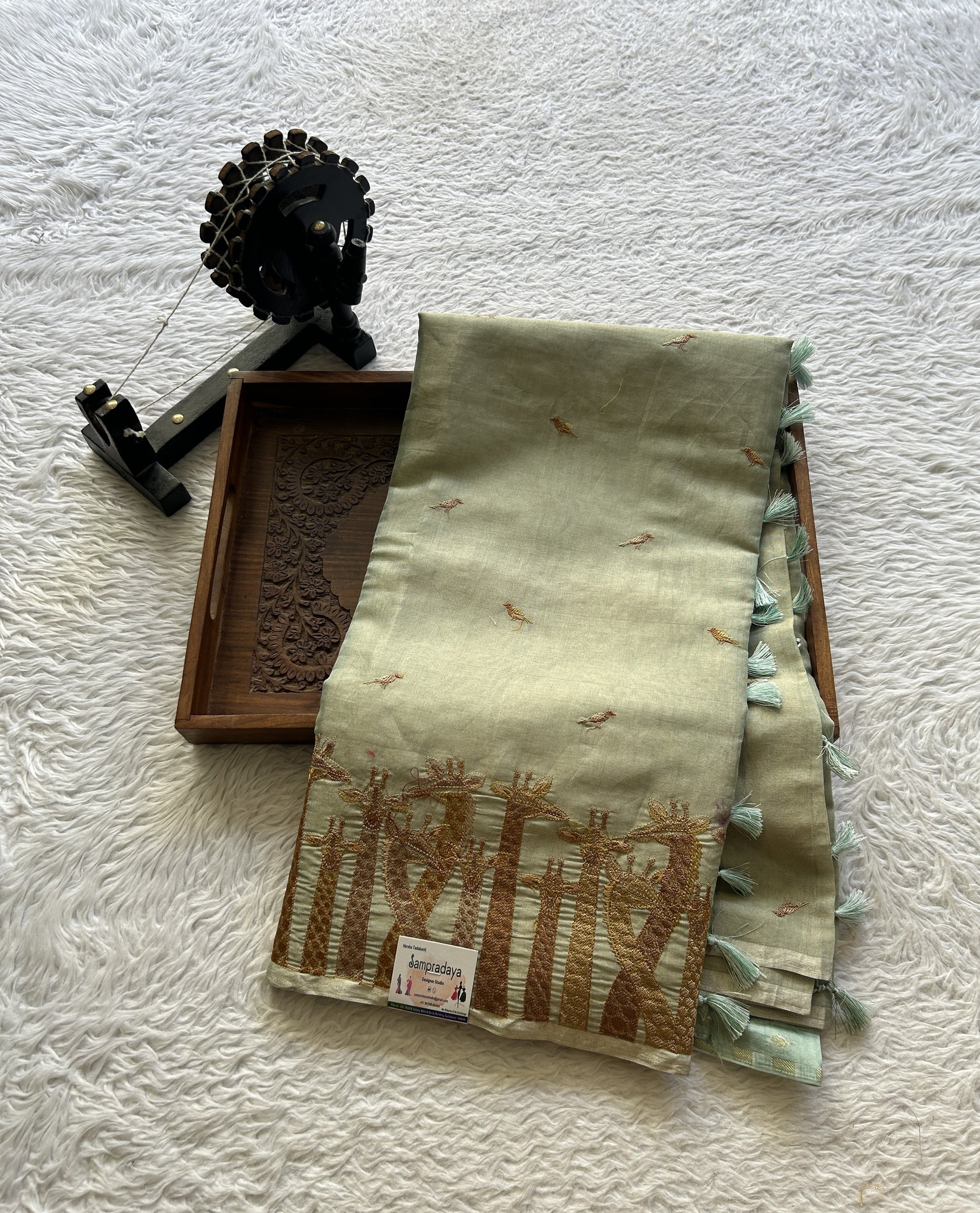 Tissue Organza Designer Saree Sage colored Saree Paired with a Thread border. - Sampradaya Designer Studio