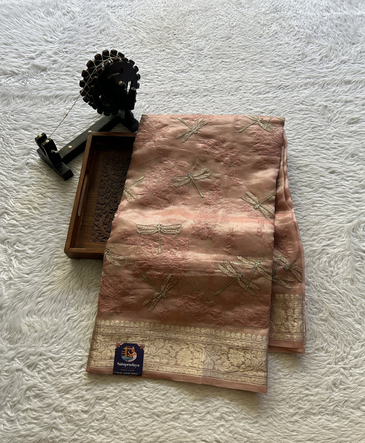 Tissue Organza Designer Saree Light Peach colored Saree Paired with a Zari border. - Sampradaya Designer Studio