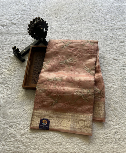 Tissue Organza Designer Saree Light Peach colored Saree Paired with a Zari border. - Sampradaya Designer Studio