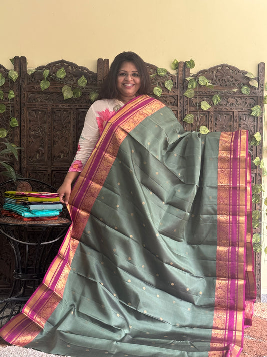 Pure Kanjivaram Silk Saree Grey Colored Complemented with Pink color Border with a Gold Zari Weaving. - Sampradaya Designer Studio