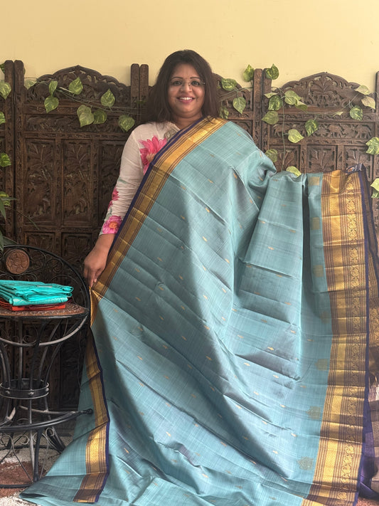 Pure Kanjivaram Silk Saree Greyish Blue Colored Complemented with Violet color Border with a Gold Zari Weaving. - Sampradaya Designer Studio