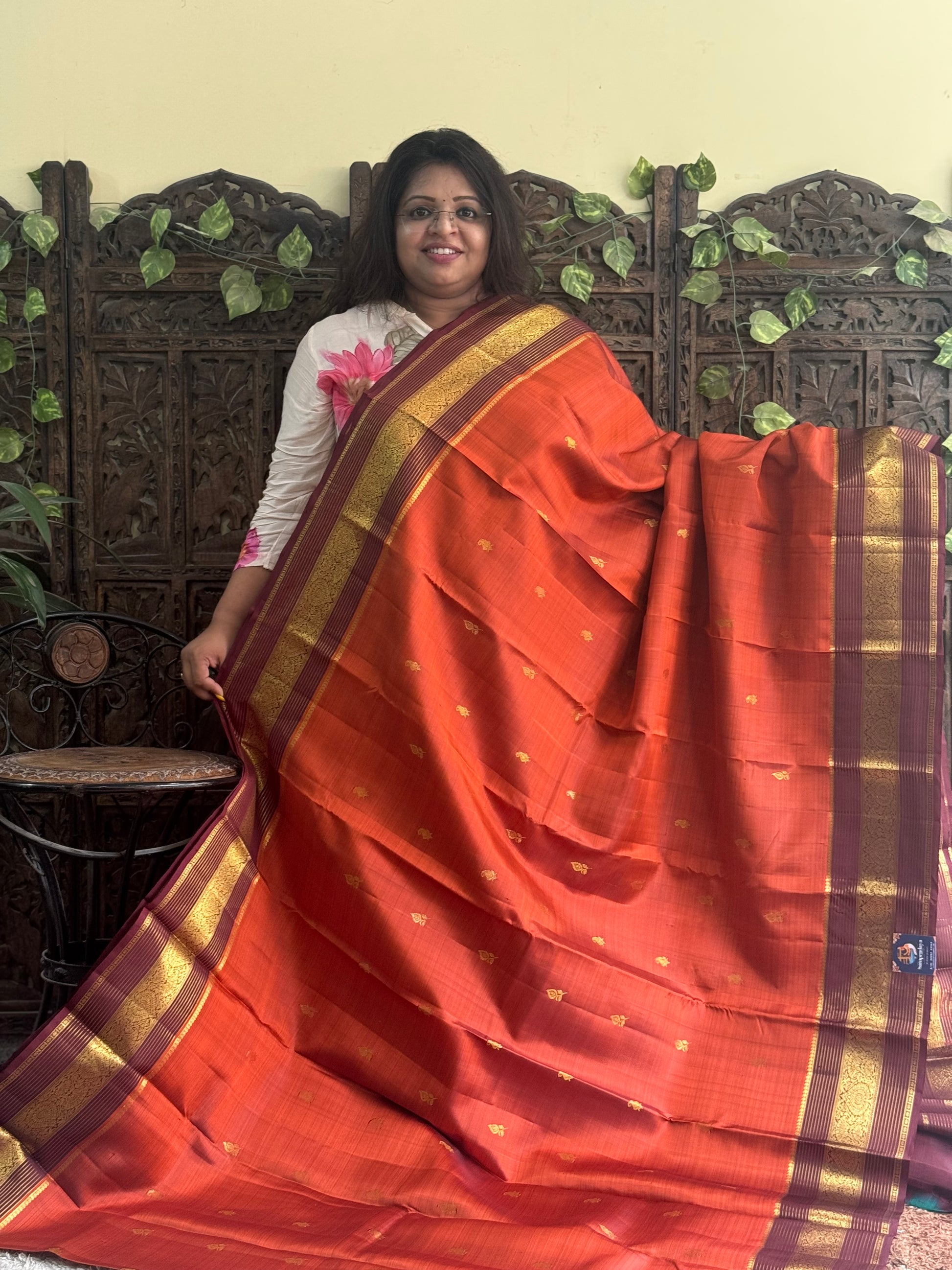 Pure Kanjivaram Silk Saree Rusted Orange Colored Complemented with Brown color Border with a Gold Zari Weaving. - Sampradaya Designer Studio