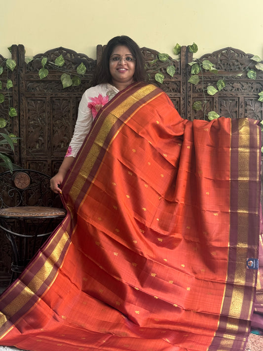 Pure Kanjivaram Silk Saree Rusted Orange Colored Complemented with Brown color Border with a Gold Zari Weaving. - Sampradaya Designer Studio