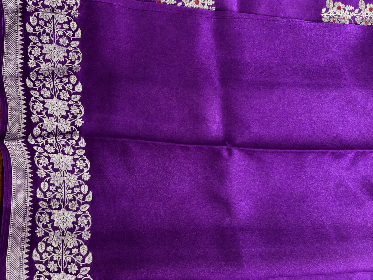 Pure Chiniya Silk Saree Purple Colored Elegantly Paired with a Gold Zari Border.