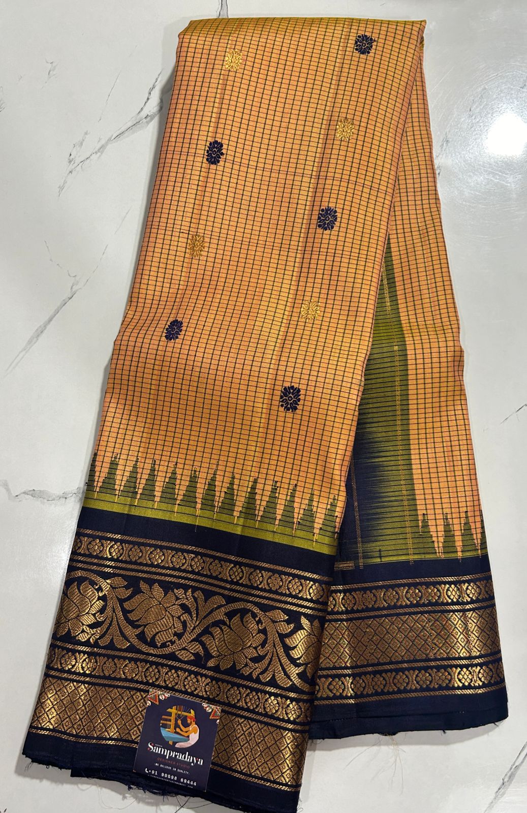 Gadwal Silk Saree Light Orange Colored Complemented With a Navy Blue Color Kanchi Border - Sampradaya Designer Studio