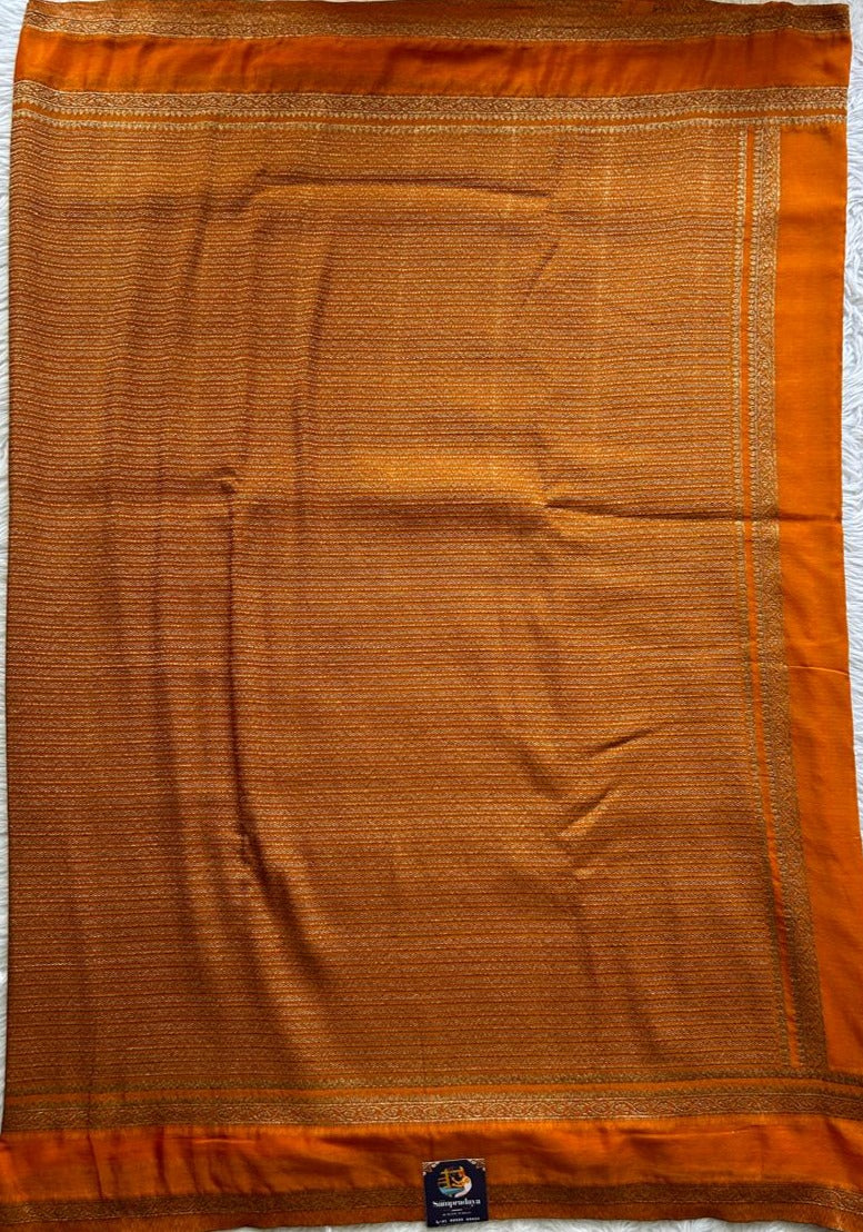 Semi Georgette Saree Orange Colored Complemented with a Zari Border. - Sampradaya Designer Studio