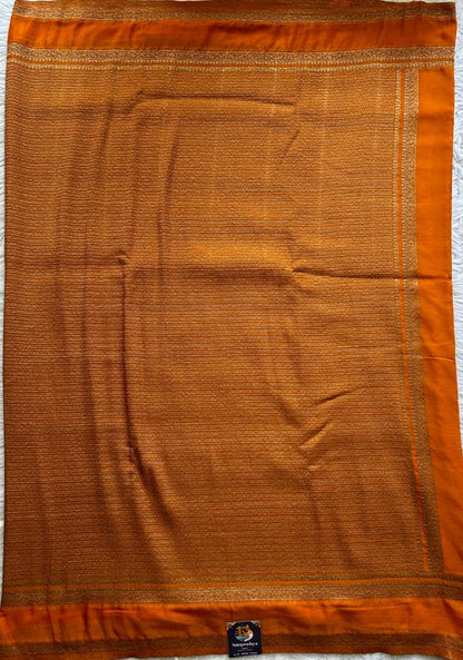 Semi Georgette Saree Orange Colored Complemented with a Zari Border. - Sampradaya Designer Studio