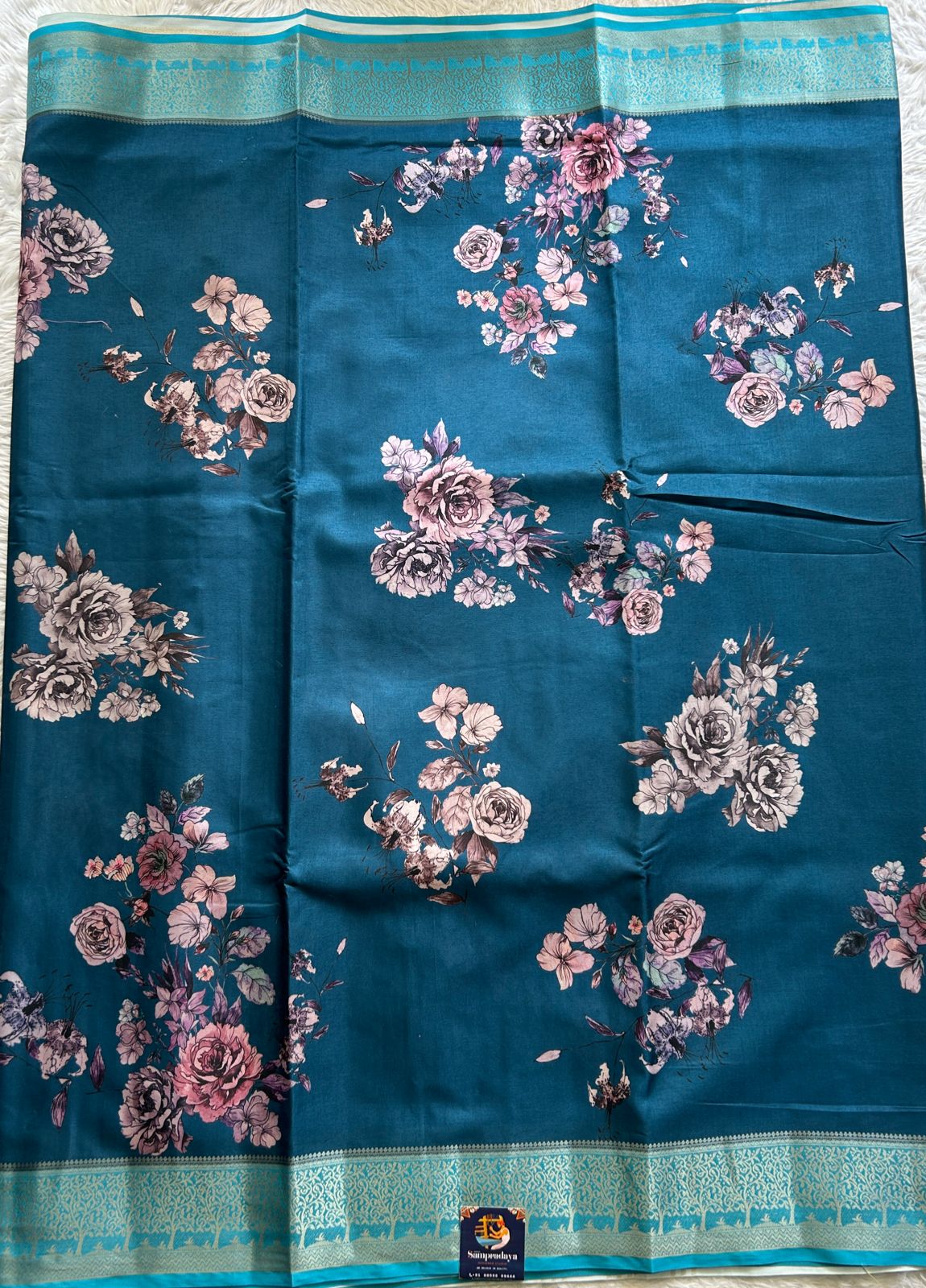 Semi Raw Silk Saree Teal Blue Colored Complemented with a Zari Border. - Sampradaya Designer Studio